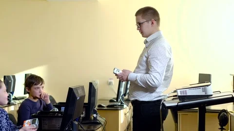 Teacher with computer takes a math class 4k Stock Footage 74290285