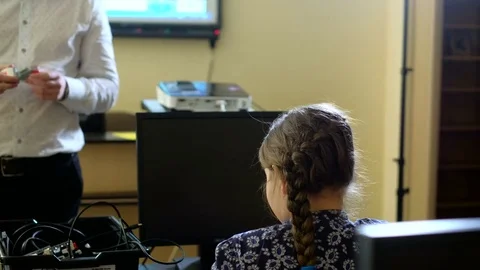 Teacher with computer takes a math class 4k Stock Footage 74290653