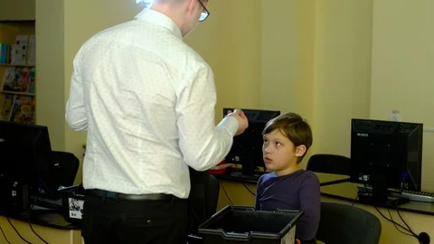 Teacher with computer takes a math class 4k Stock Footage 74403793