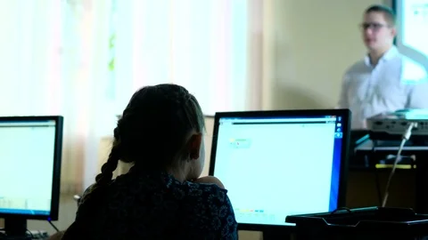 Teacher with computer takes a math class 4k Stock Footage 74585612