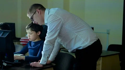 Teacher with computer takes a math class 4k Stock Footage 74608669