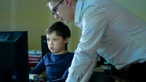 Teacher with computer takes a math class 4k Stock Footage 74608718
