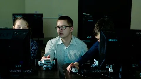 Teacher with computer takes a math class 4k Stock Footage 74780066