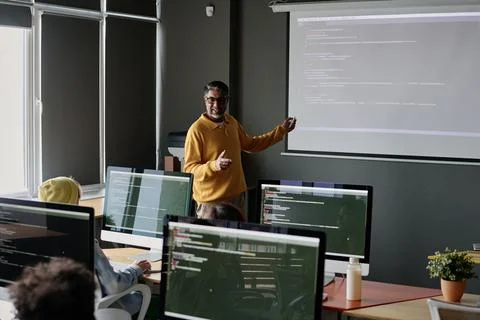 Teacher Conducting Coding Lesson Stock Photos