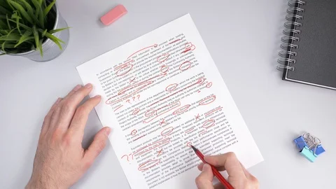 Teacher Correcting Exam or Homework With Red Marker Fast Stock Footage 99748322