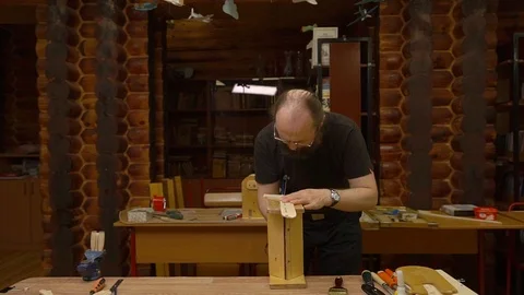 Teacher cuts plane model figure with blue metal fretsaw 스톡 동영상 127113704