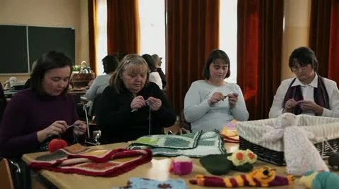 Teacher is demonstrating basics of knitting to the course participants Stock Footage 27814675