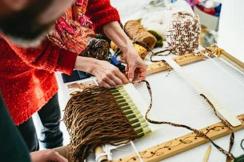 Teacher demonstrating making a fringe Stock Photos