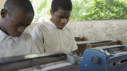 Teacher of disabilities working with blind students in school classroom. Video stock 121456661