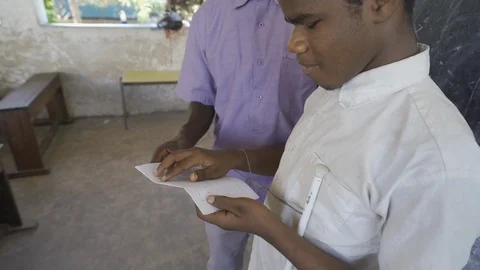 Teacher of disabilities working with blind students in school classroom. Stock Footage 121462148