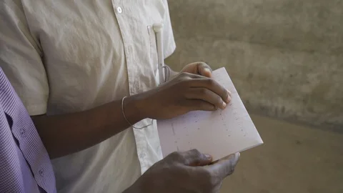 Teacher of disabilities working with blind students in school classroom. Stock Footage 121462380