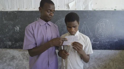 Teacher of disabilities working with blind students in school classroom. Stock Footage 121462564