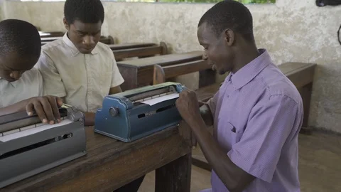 Teacher of disabilities working with blind students in school classroom. Stock Footage 121462726