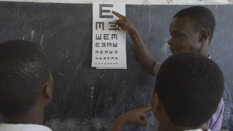 Teacher of disabilities working with partially sighted students. Stock Footage 121466168