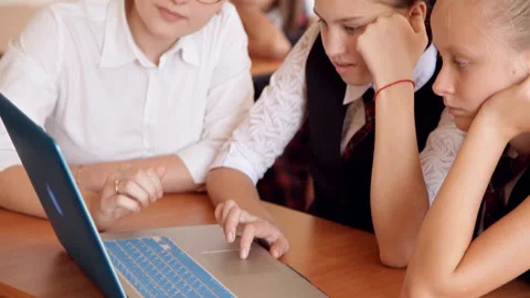 Teacher discussing a computer program with a group of pupils Stock Footage 99326828