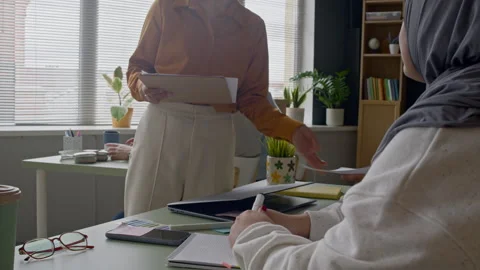 Teacher Distributing Worksheets to Students in Classroom Vídeo Stock 314831005