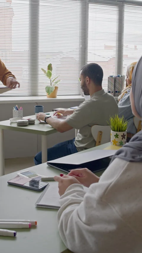 Teacher Distributing Worksheets to Students Vídeo Stock 314837287
