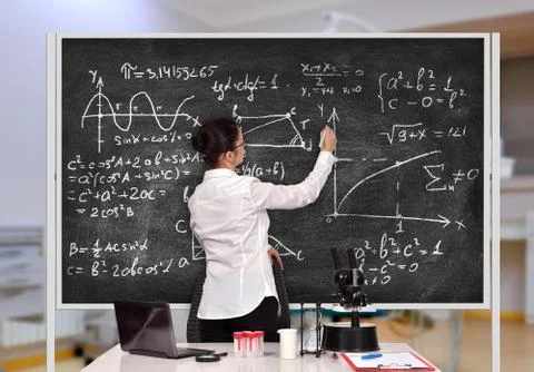 Teacher drawing formula Stock Photos