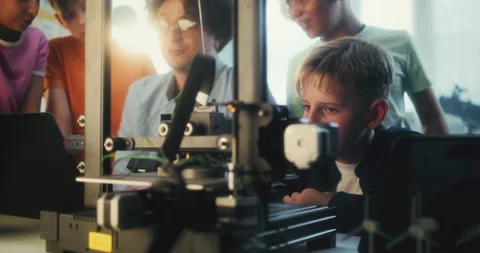 Teacher Educating Group of Smart Kids During Engineering and Programming Lesson Stock Footage 311675534