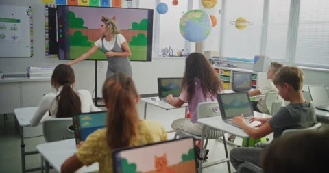 Teacher Educating Young Students During Digital Art Class, Showing Creative Stock Footage 315471489