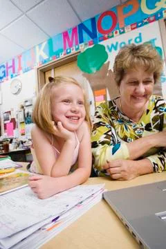 Teacher With Elementary Student Stock Photos