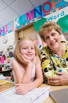 Teacher With Elementary Student Stock Photos