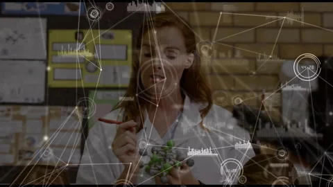Teacher entering frame with molecular model and pointer starting science lesson Stock Footage 316191408