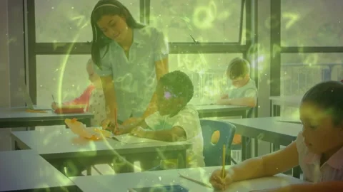 Teacher entering, leaning over boy and guiding math writing while numbers Stock Footage 330142674