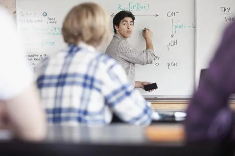 Teacher explaining chemistry to class 스톡 사진