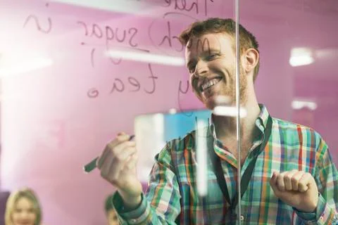Teacher explaining the lesson to his students. Stock Photos