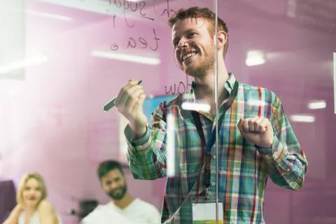 Teacher explaining the lesson to his students. Stock Photos