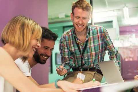 Teacher explaining the lesson to his students. Stock Photos