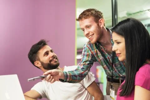 Teacher explaining the lesson to his students. Stock Photos