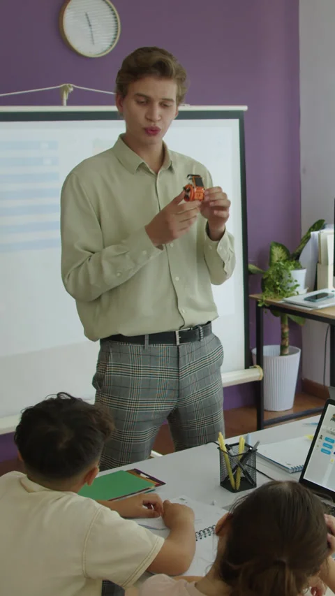 Teacher Explaining Principles of Robot Work at IT Class with Kids Stock Footage 280637894