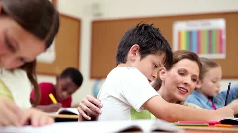 Teacher explaining something to a pupil Stock Footage 10844264