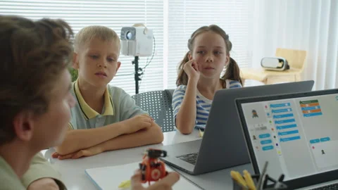 Teacher Explaining Topic to Children at Robot Engineering Class Stock Footage 280540504