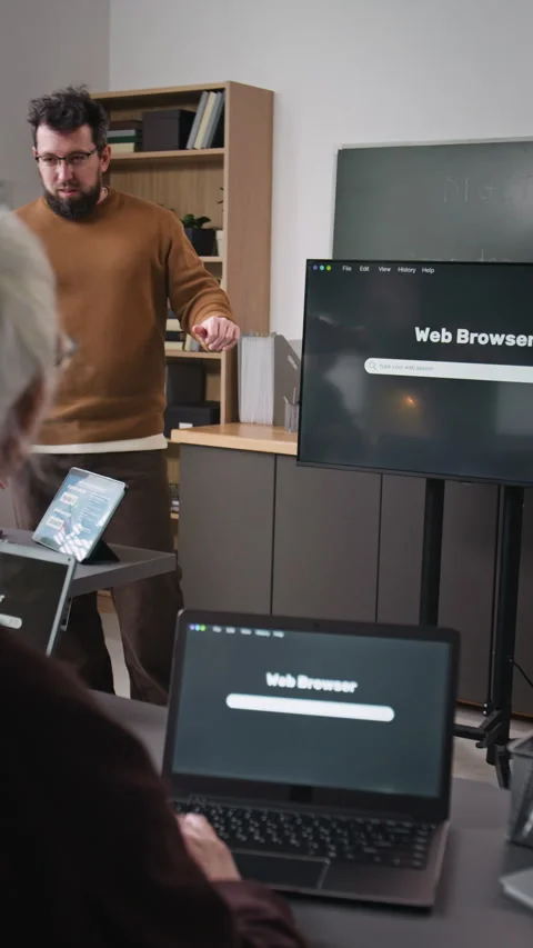 Teacher Explaining Web Search to Senior People Vertical Stock Footage 333756882