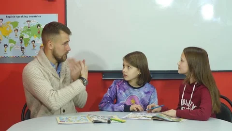 The teacher explains the information to the fingers of students Stock Footage 70575694