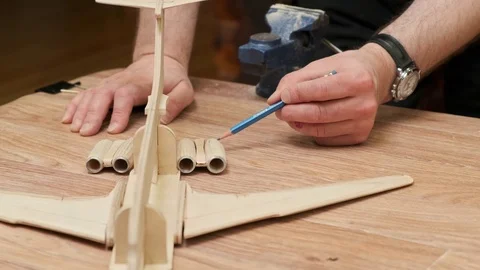 Teacher explains jetliner model engine structure at lesson Stock Footage 127377803