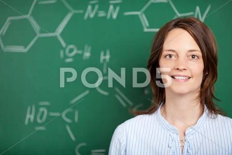Teacher in front of a blackboard Stock Photos
