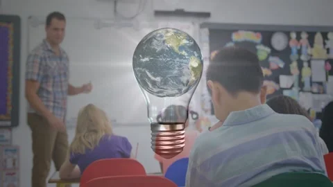 Teacher gesturing in classroom causing earth bulb appearing and flare rising Stock Footage 328229593