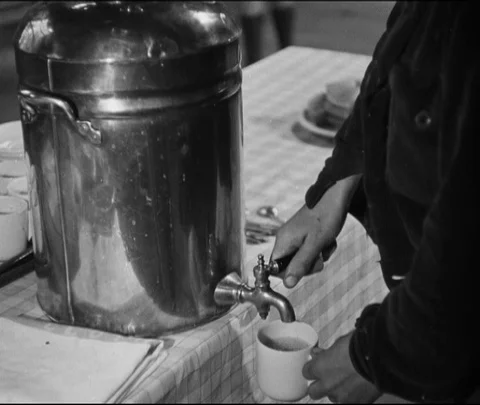 Teacher getting tea and biscuits after match, United Kingdom, UK, 1946 Stock Footage 133379400
