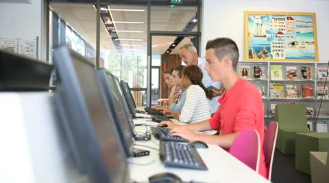 Teacher giving computing class to college students Stock Footage 37628150