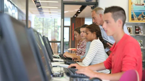 Teacher giving computing class to college students Stock Footage 37628278
