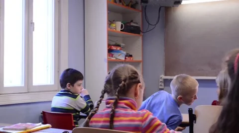 Teacher Giving lesson In Classroom, pan Stock Footage 40453377