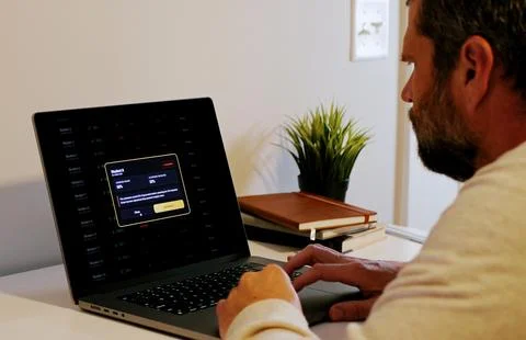 Teacher Grading Papers with AI to Flag Plagiarism Stock Photos