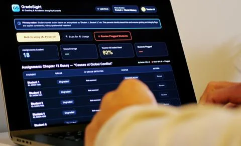 Teacher Grading Papers with AI to Flag Plagiarism 스톡 사진