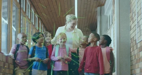 Teacher guiding class down corridor while green code symbols emerging overhead Stock Footage 318011383