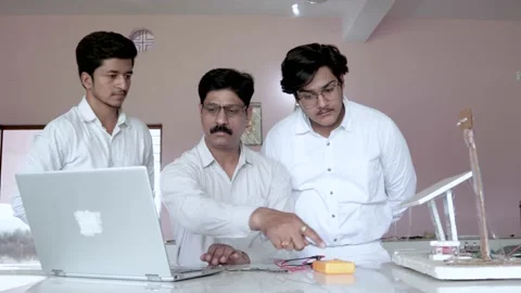 Teacher Guiding Student on there project in Lab Stock Footage 157057665
