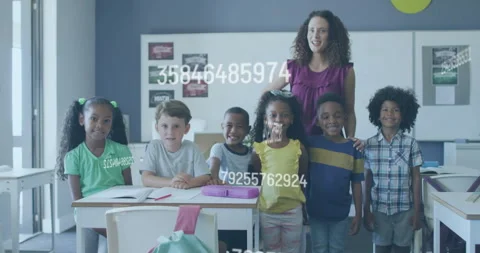 Teacher guiding students in classroom as numeric codes begin scrolling Stock Footage 315534516